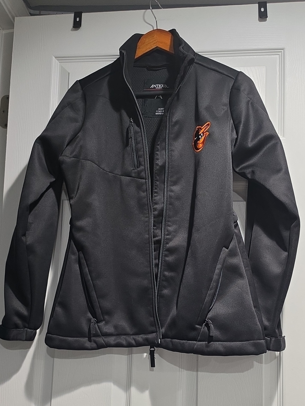 Antigua Black Softshell Jacket with Orange Embroidered Logo